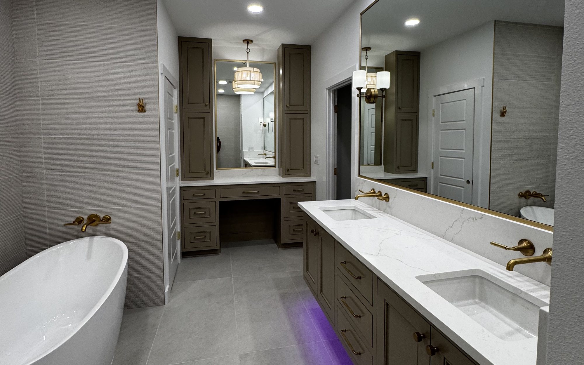 Primary bathroom remodel by Siana Remodeling with a freestanding tub, double vanity and brass fixtures
